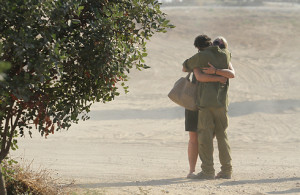 Sgt. Maj. Adi Briga’s last hug with his girlfriend Yuliya, three days before he was killed in Gaza.