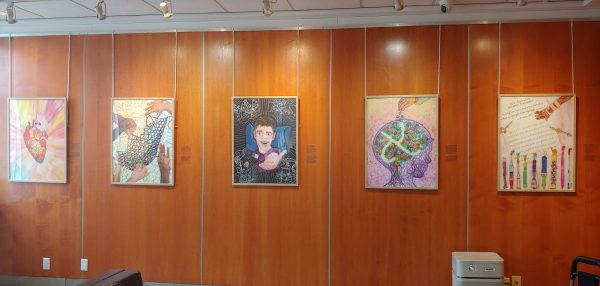 Series of posters hanging on a wall